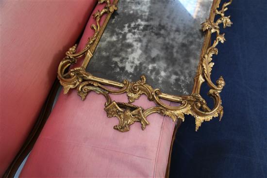 A George III Chippendale style carved and giltwood wall mirror, in the manner of Mathias Lock, W.2ft 3in. H.4ft 5in.